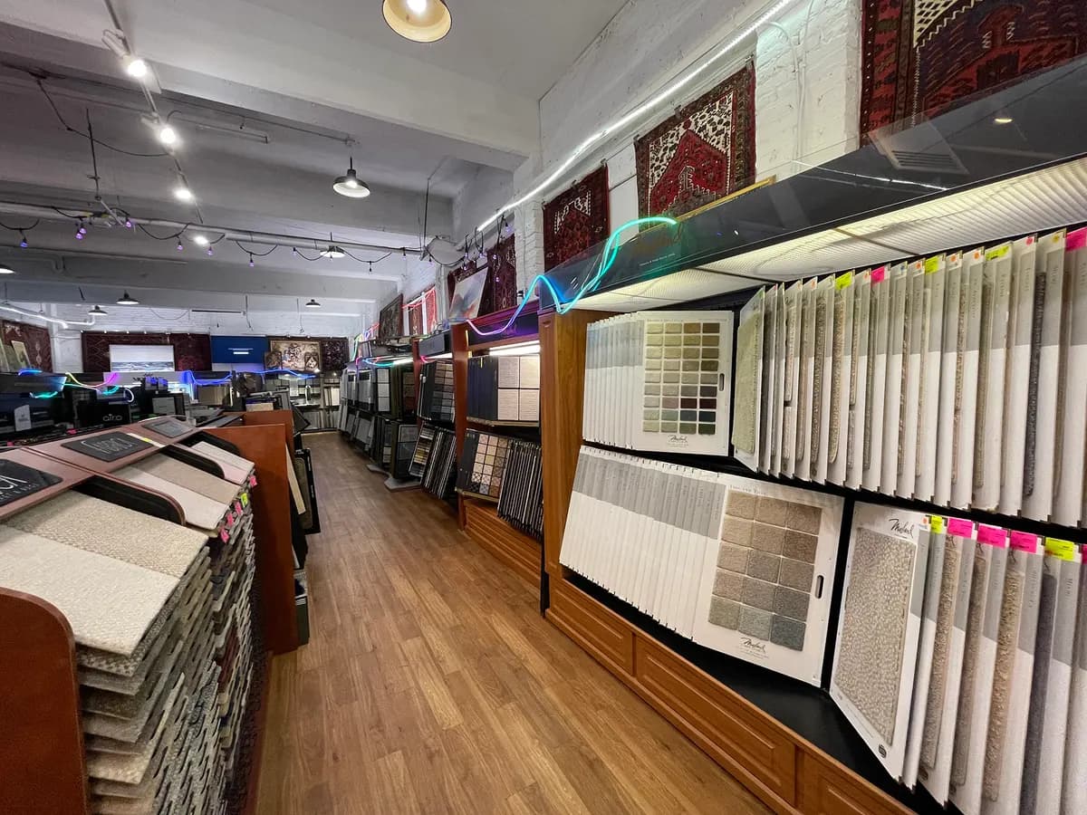 Sample racks along the right side of the showroom